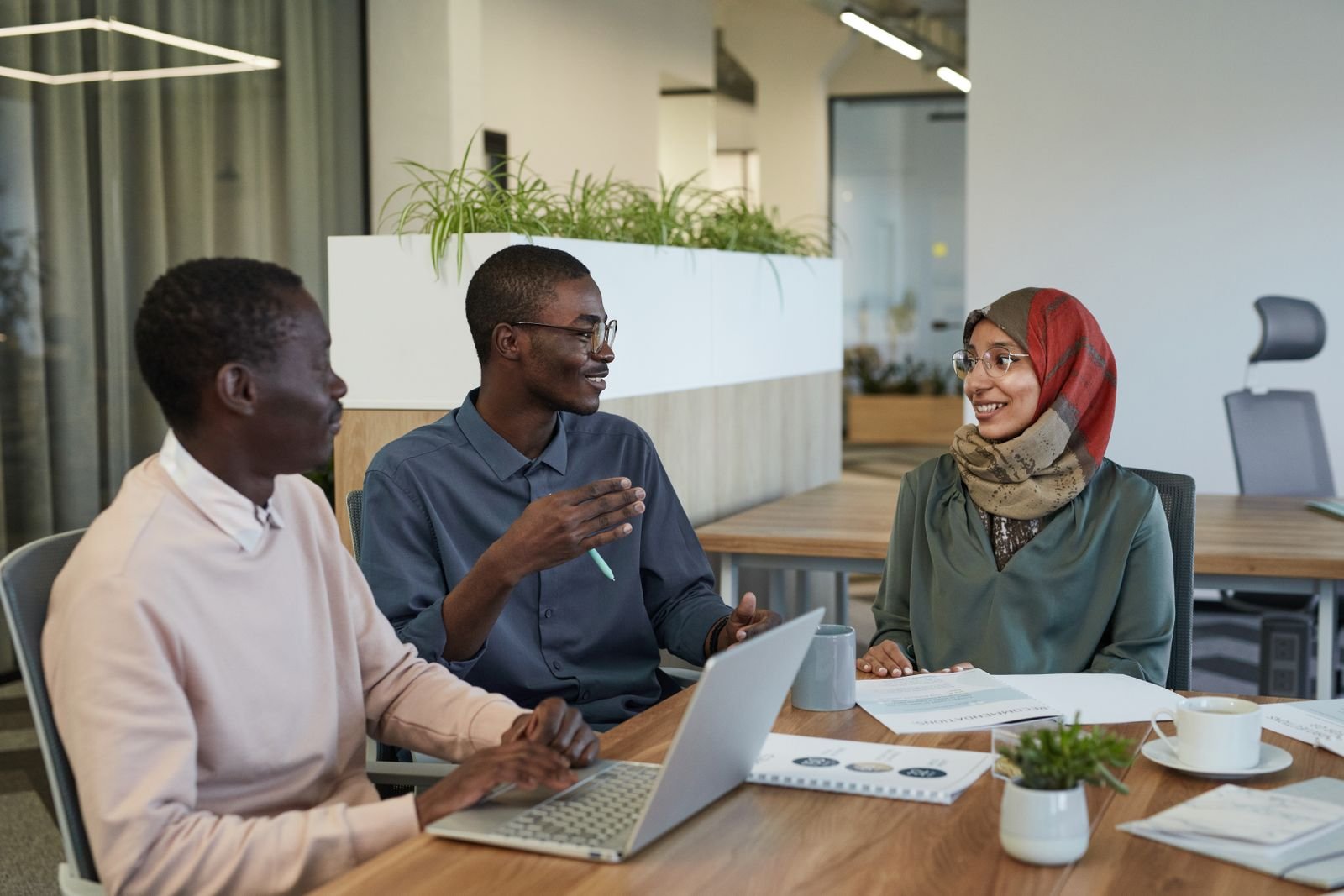 A diverse team of business professionals collaborating in a modern office
